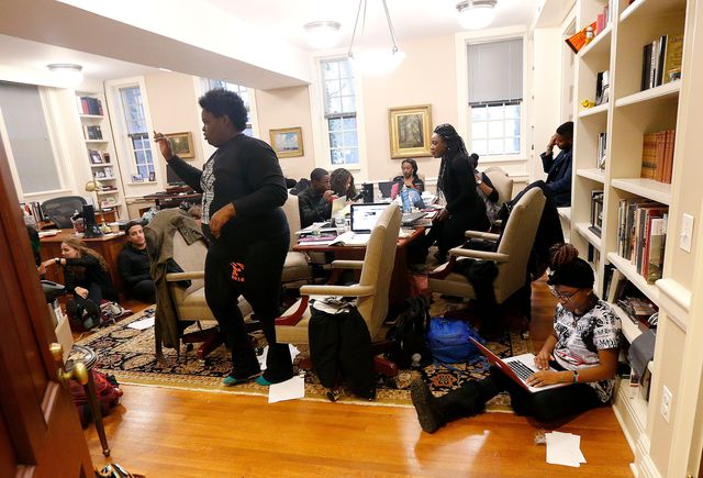 Students are seen inside the office of Princeton University President Christopher Eisgruber, in Princeton, N.J. The protesters from a group called the Black Justice League demand the school remove the name of former school president and U.S. President Woodrow Wilson from programs and buildings over what they said was his racist legacy
